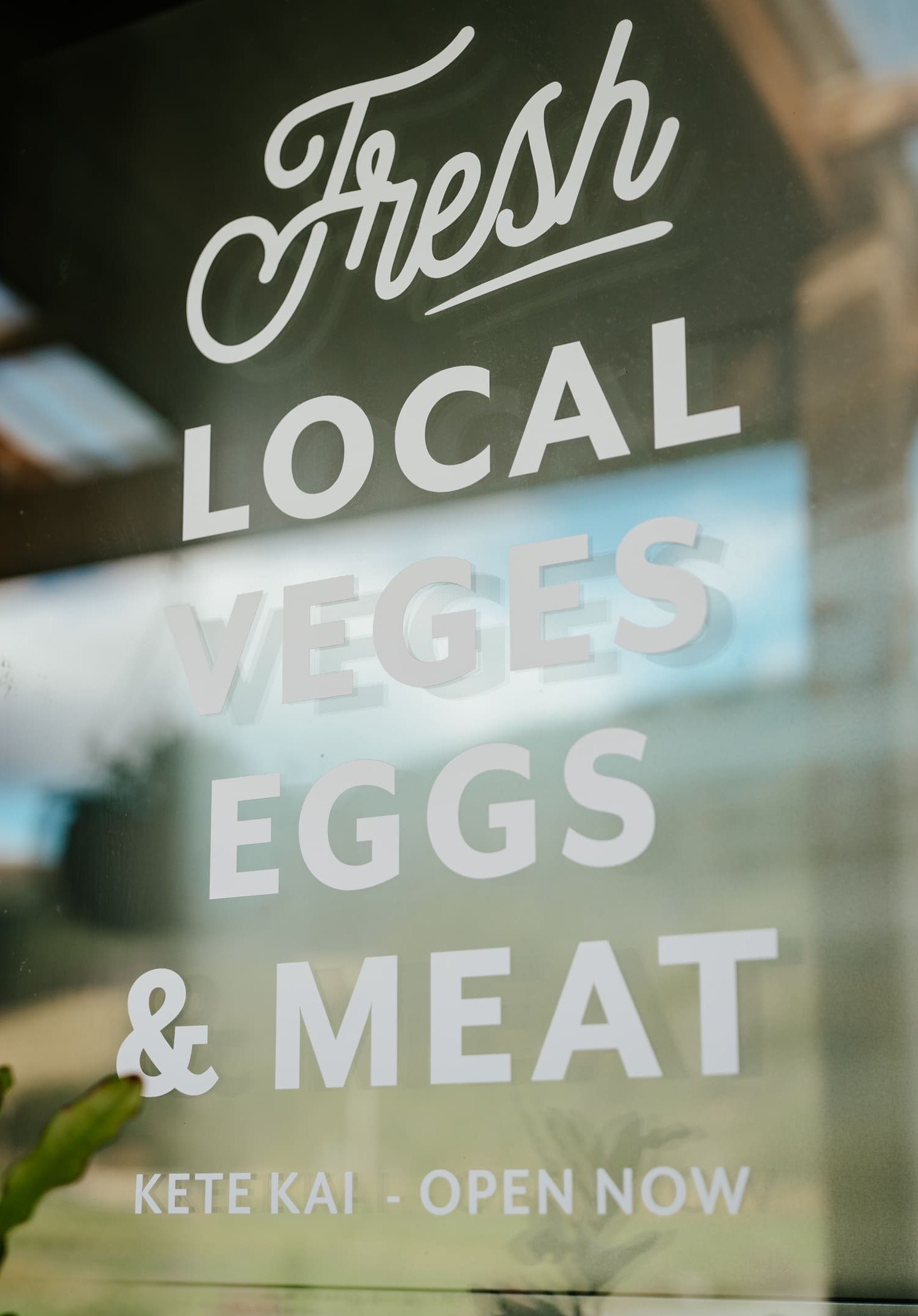 Fresh local veges, eggs and meat — the Kete Kai window sign at the Mangaroa Farm Shop