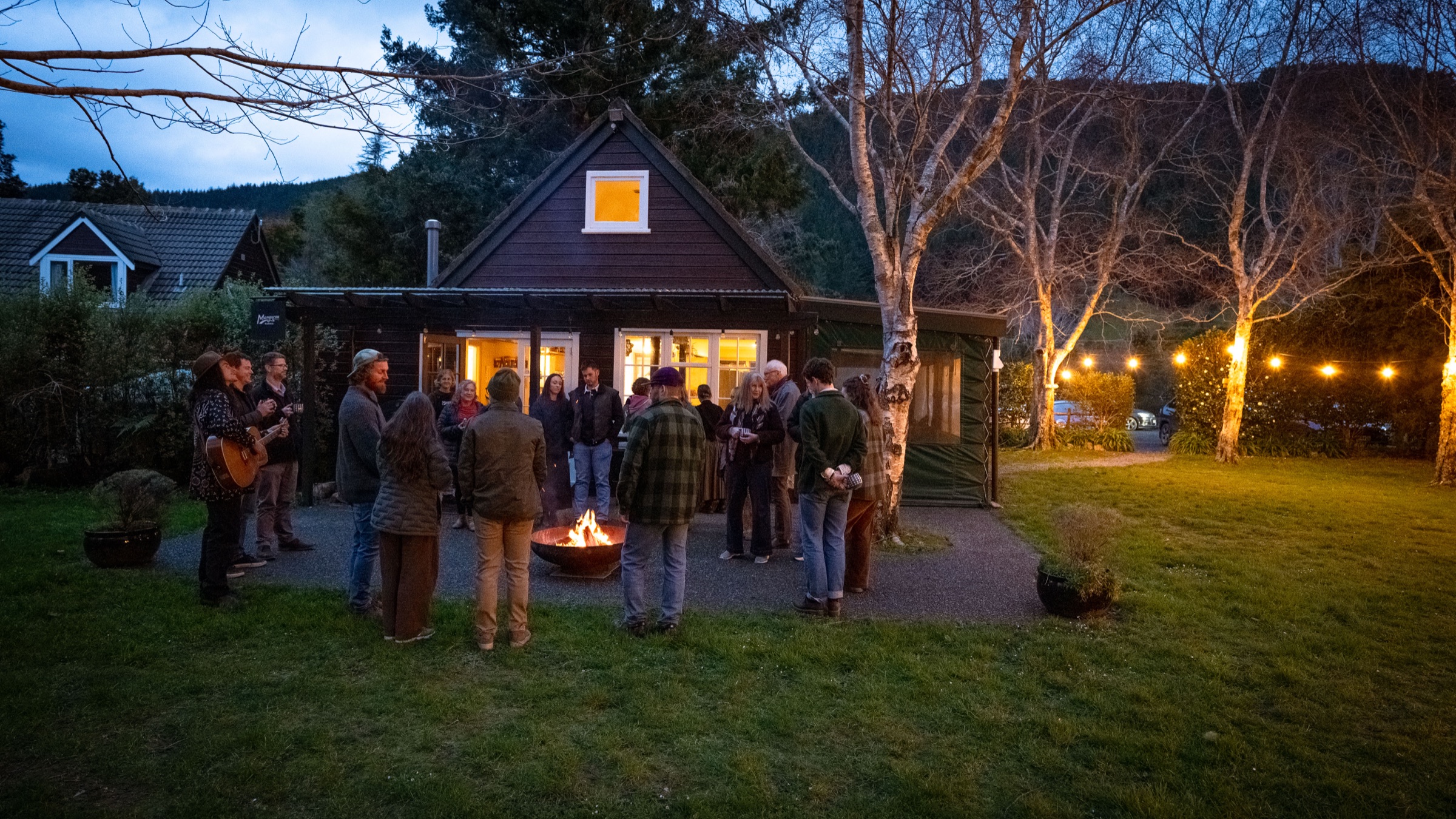 Gathering around the fire as the evening begins