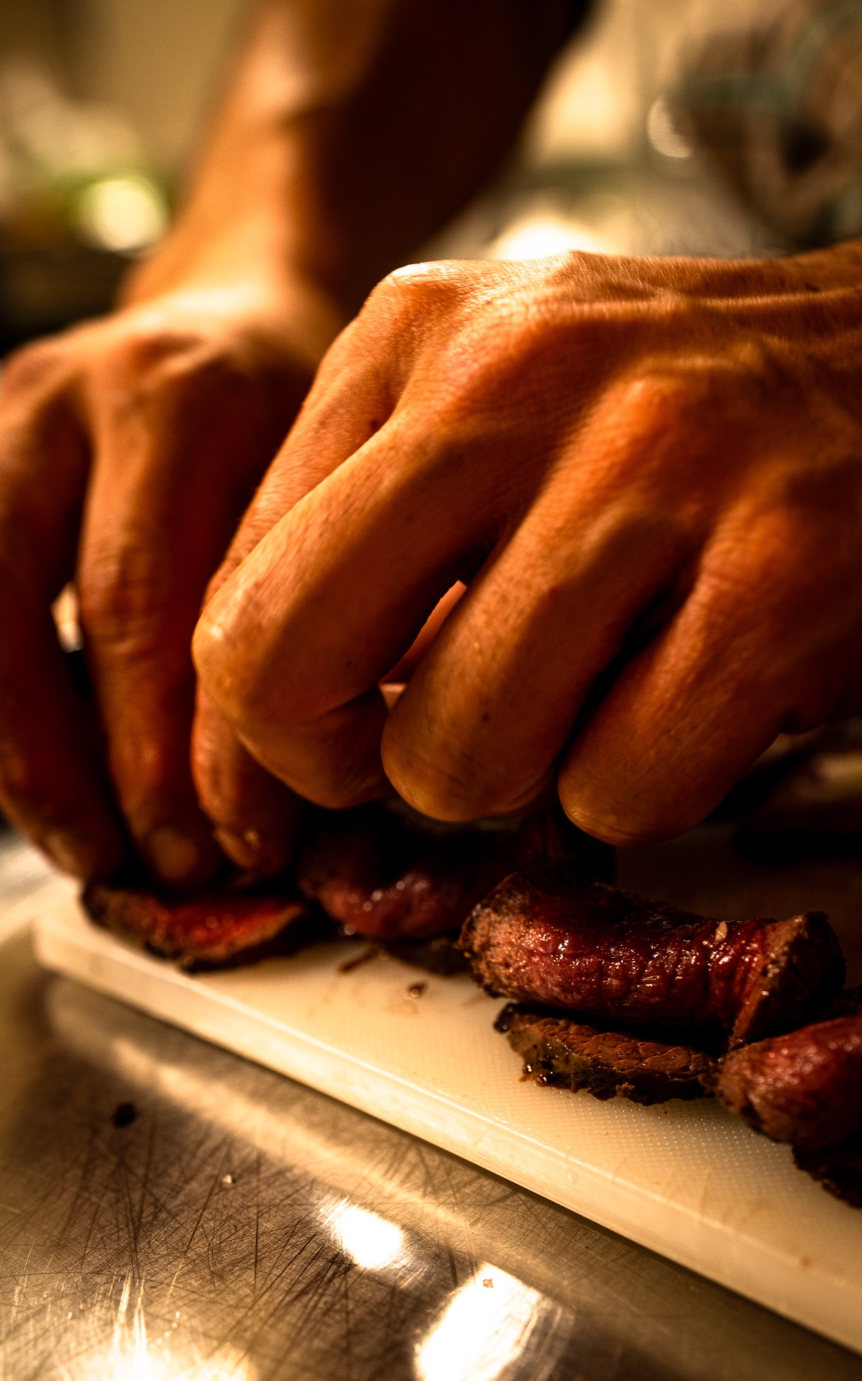 Slicing the slow-cooked beef brisket