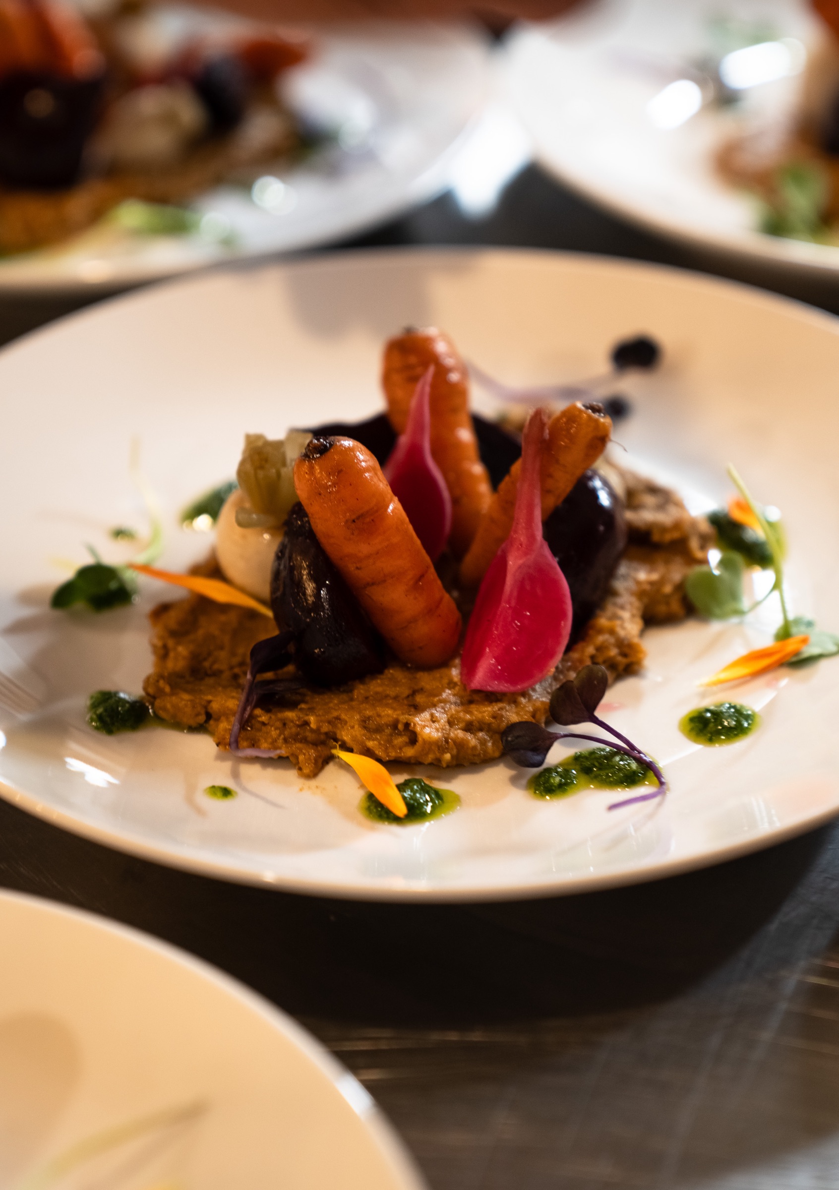 The entree: seasonal and preserved baby vegetables 'growing' from the plate