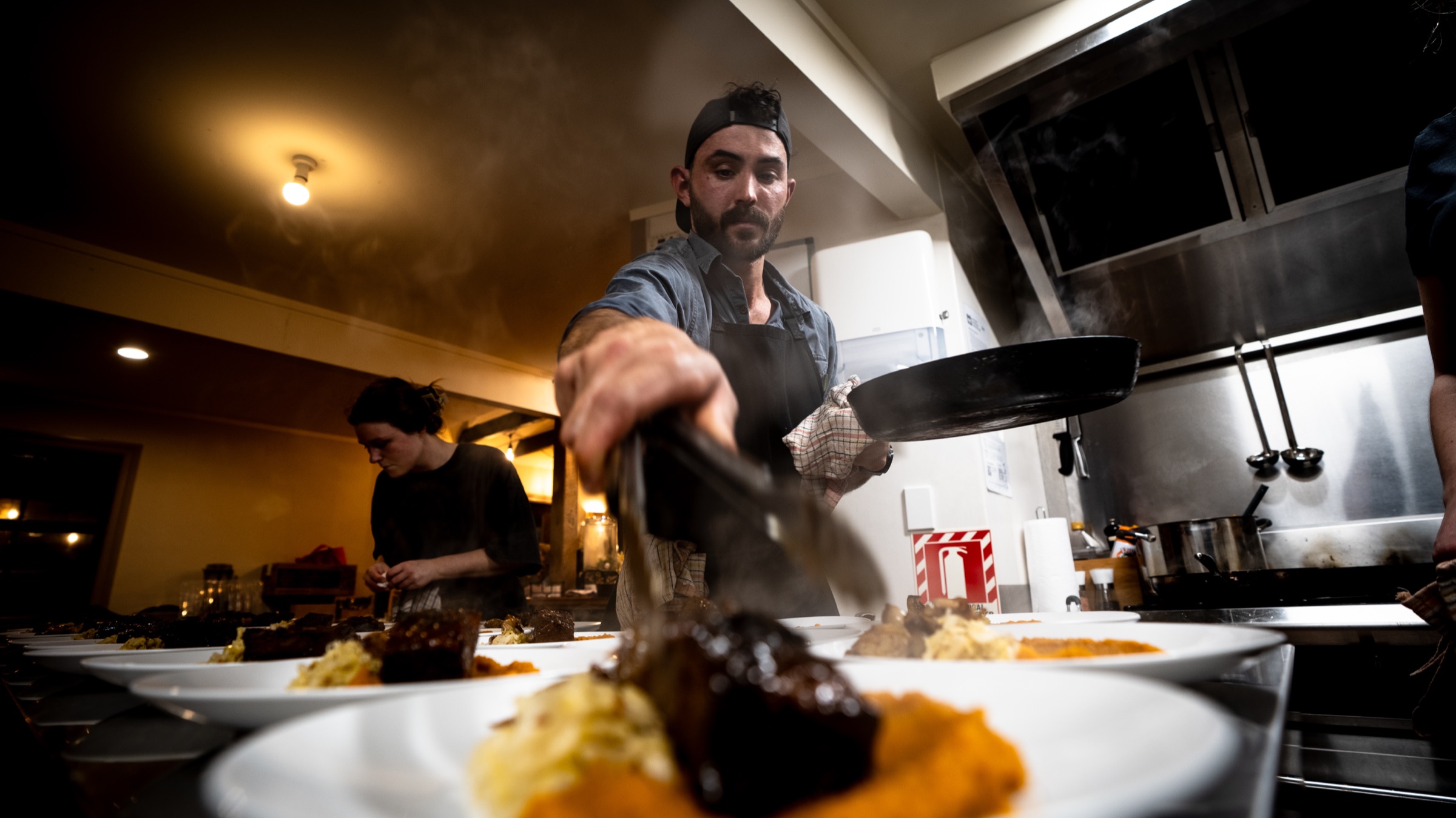 Plating the slow-cooked beef brisket