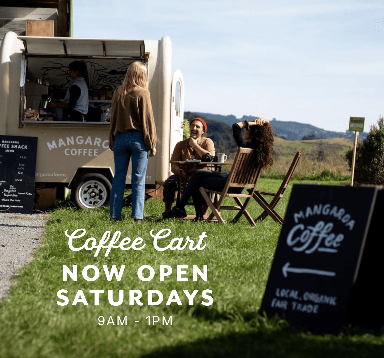 Mangaroa Coffee Cart now open Saturdays 9am-1pm — friends enjoying coffee beside the cart with the valley hills behind